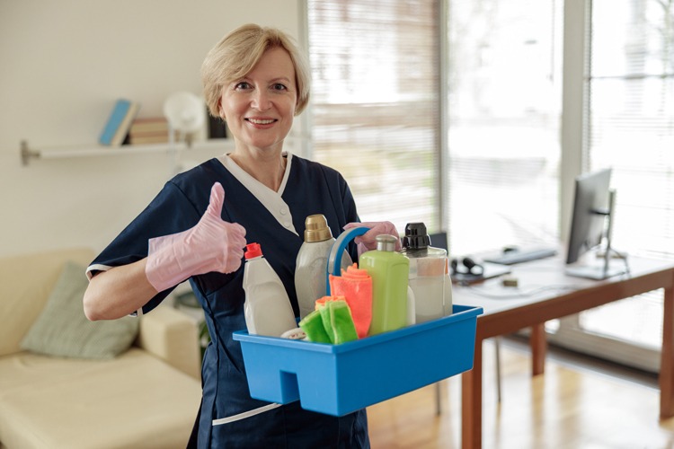 A care giver helping with cleaning a home